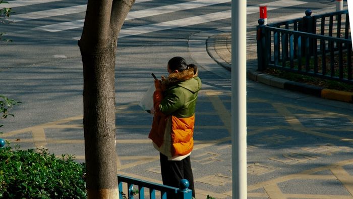 A phone showing a fraud alert notification about suspicious financial activity