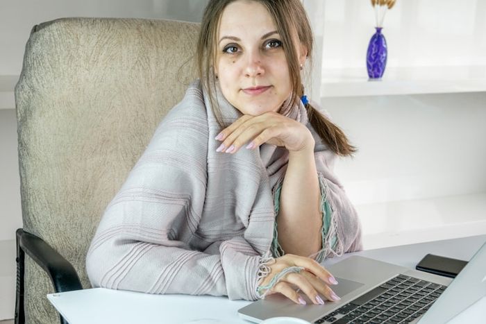 A person looking confused at their computer after seeing a scam pop-up